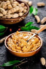 Peanut butter in a wooden plate. 