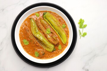 Mirchi or mirch ka Salan. Green chilly sabzi. It is a popular Indian chili and peanut curry from Hyderabad. Accompanies Hyderabadi mutton or chicken biryani. Copy space. 