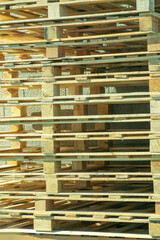 Stack of raw construction or industrial warehouse pallets used to transport goods and stack comercial products