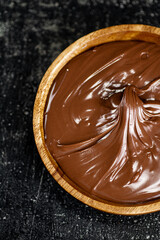 Wooden plate with hazelnut butter. 