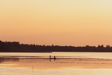 Fisherman's boat on the river with sunset.
