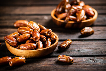 Fresh dates in two plates. 