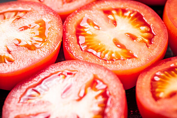 A round piece of tomato. Macro background. 