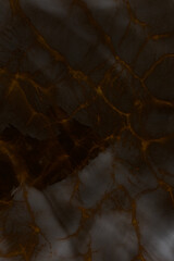 An abstract photo of the texture of light reflections from a transparent water surface and waves in dark brown tones.