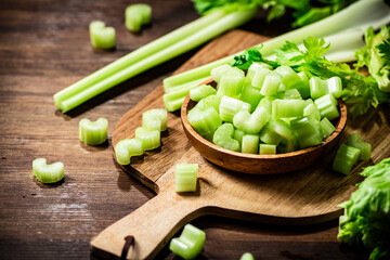 Sliced fresh celery on a cutting board. 