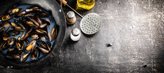 Mussels are cooked in a pot of water. 