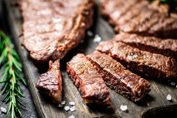 Flavorful grilled steak on a cutting board. 