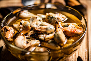 Pickled mussels in a glass bowl. 