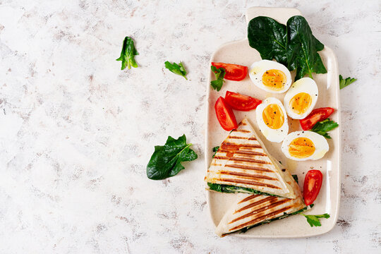 Fresh Tortilla Wraps With Spinach And Cheese On Light Background .  Healthy Food Concept. Vegetarian Food. Top View, Overhead