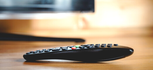 TV set-top box on a wooden background in