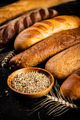 Various bread with grain in a bowl on the table. 