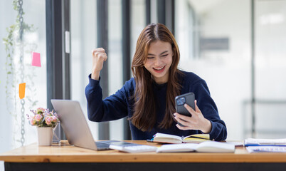 Excited asian woman sit at desk feel euphoric win online lottery, happy black woman overjoyed get mail at tablet being promoted at work, biracial girl amazed read good news at computer