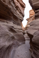 Fantastically beautiful landscape in the national nature reserve - Red Canyon in the rays of the setting sun, near the city of Eilat, in southern Israel