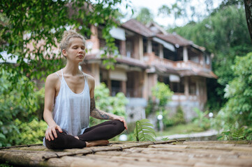 Girl practice yoga meditation outdoor in park