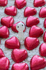 The men figure in the heart shape chocolate candies 