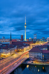 The center of Berlin with the famous TV Tower and a clouded sky at twilight