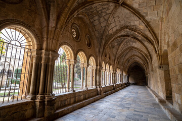 Fototapeta premium Corridor of the cloister of the monastery of the Santa Tecla Cathedral in Tarragona, Catalonia, Spain