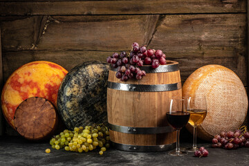 Whole round Head of parmesan or parmigiano hard cheese and wine on a wooden background. farmer...