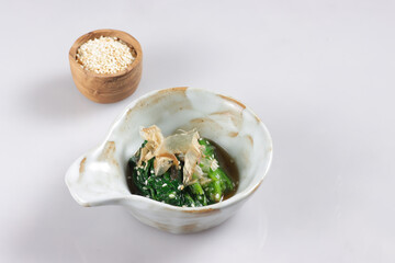 Spinach Ohitashi is a Dish in wich Spinach Stepped in a Dashi Based Sauce, served with bonito flakes. 
