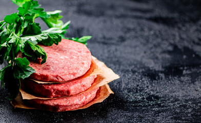 Pile raw burger on the table. 