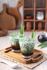 Cendol is an iced sweet dessert that contains droplets of green rice flour jelly, coconut milk and palm sugar syrup. It is commonly found in Indonesia, Malaysia, Brunei, Cambodia, and Singapore