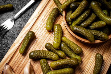 Pickles cucumber on a cutting board. 