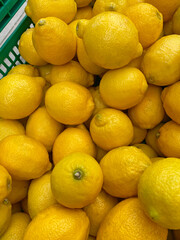 Freshly picked lemons for sale at a vegetable market