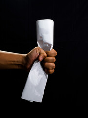 Man hand holding a white paper