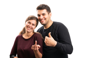 Girlfriend showing middle finger boyfriend making like gesture