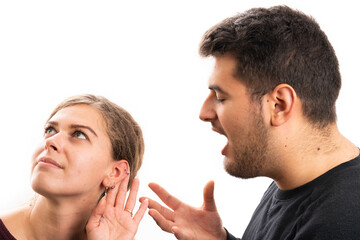 Girlfriend making listening gesture while boyfriend yelling