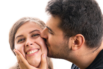 Fototapeta premium Boyfriend kissing cute girlfriend cheek as couple concept