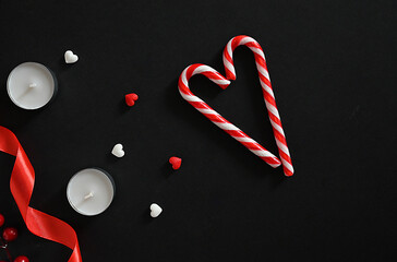 Hearts and candles on a dark background. The concept of celebrating Valentine's Day, Mother's Day