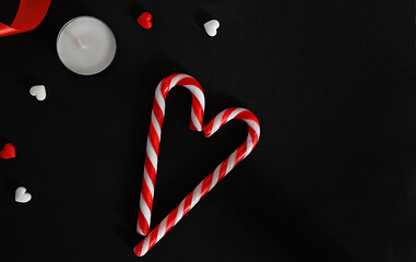 Hearts and candles on a dark background. The concept of celebrating Valentine's Day, Mother's Day