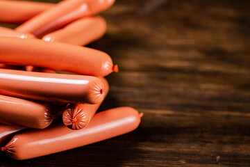 A bunch of sausages on the table. 