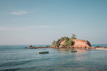 Mirissa, Sri Lanka : View from the beach on Parrot Rock Islet on a sunny morning