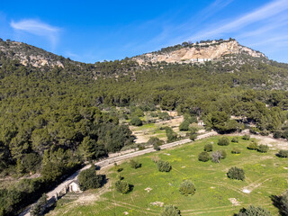 Fototapeta na wymiar sowing field under the sanctuaries of Gracia and Sant Honorat, Puig de Cura, Algaida-Llucmajor, Majorca, Balearic Islands, Spain