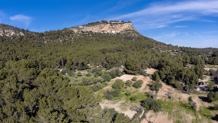 Fototapeta na wymiar sowing field under the sanctuaries of Gracia and Sant Honorat, Puig de Cura, Algaida-Llucmajor, Majorca, Balearic Islands, Spain
