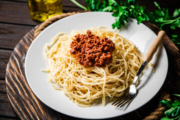 Delicious spaghetti bolognese with parsley. 