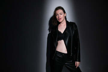 beautiful fashionable woman brunette in black clothes and underwear