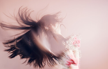 Fototapeta premium Young woman with bouquet of flowers. Double exposure effect.