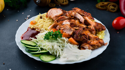 Fried chicken fillet with rice, tomatoes, cabbage, cucumbers, ketchup and mayonnaise.