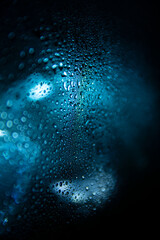 drops of water on glass with a refreshing blue background with a really tight f-stop