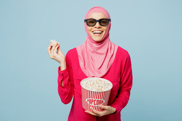 Young laughing happy arabian muslim woman woman in 3d glasses abaya hijab watch comedy movie film...