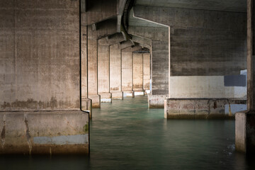 Fototapeta na wymiar Concrete pillars under the Harbour Bridge. Auckland.