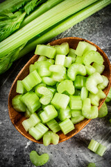 Cut into small pieces of celery in a plate. 