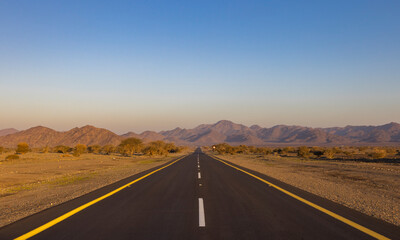 Fototapeta na wymiar Desert road in remote rural area of Al Madinah in north western Saudi Arabia