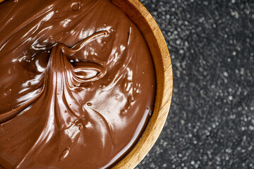 Wooden plate with hazelnut butter. 
