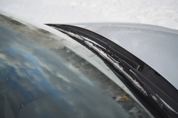 windshield wipers covered with snow