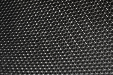 Car interior with honeycomb vinyl floor mat.