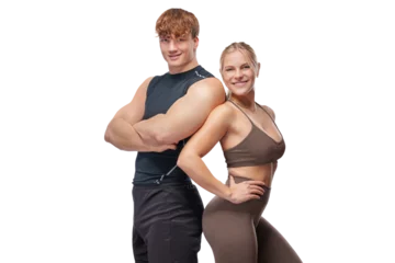 Gordijnen  Sporty young couple posing on isolated free PNG background. © Igor Link